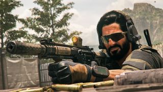 warzone 2 dmz mode - a man wearing sunglasses points a rifle offscreen