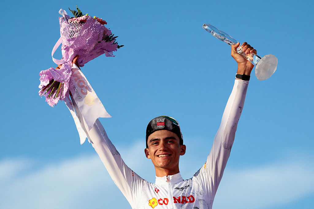 UAE Team Emirates XRG's Mexican rider Isaac Del Toro wearing the best young rider's white jersey (Maglia Bianca) celebrates on the podium at the end of the 21st and last stage of the 108th Giro d'Italia cycling race of 143kms from Rome to Rome on June 1, 2025. (Photo by Luca Bettini / AFP)