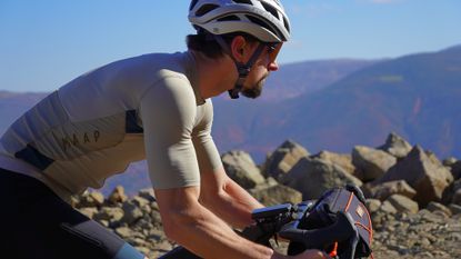 Image shows cyclist riding with a short sleeve jersey 