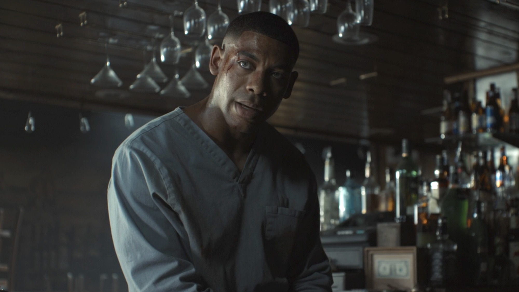 John leaning against bar talking to Lianna about not wanting the ring in Lanterns Episode 5