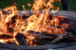 wood fire pit with flames