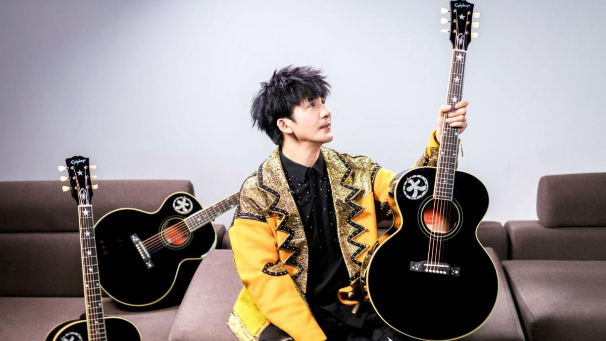 WoWkie Da posing with his signature Inspired by Gibson Custom WoWkie Da J‑180 acoustic
