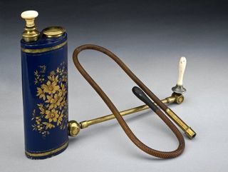 Japanese self-administering enema syringe with a piston and reservoir, weird medical instruments, historical medicine