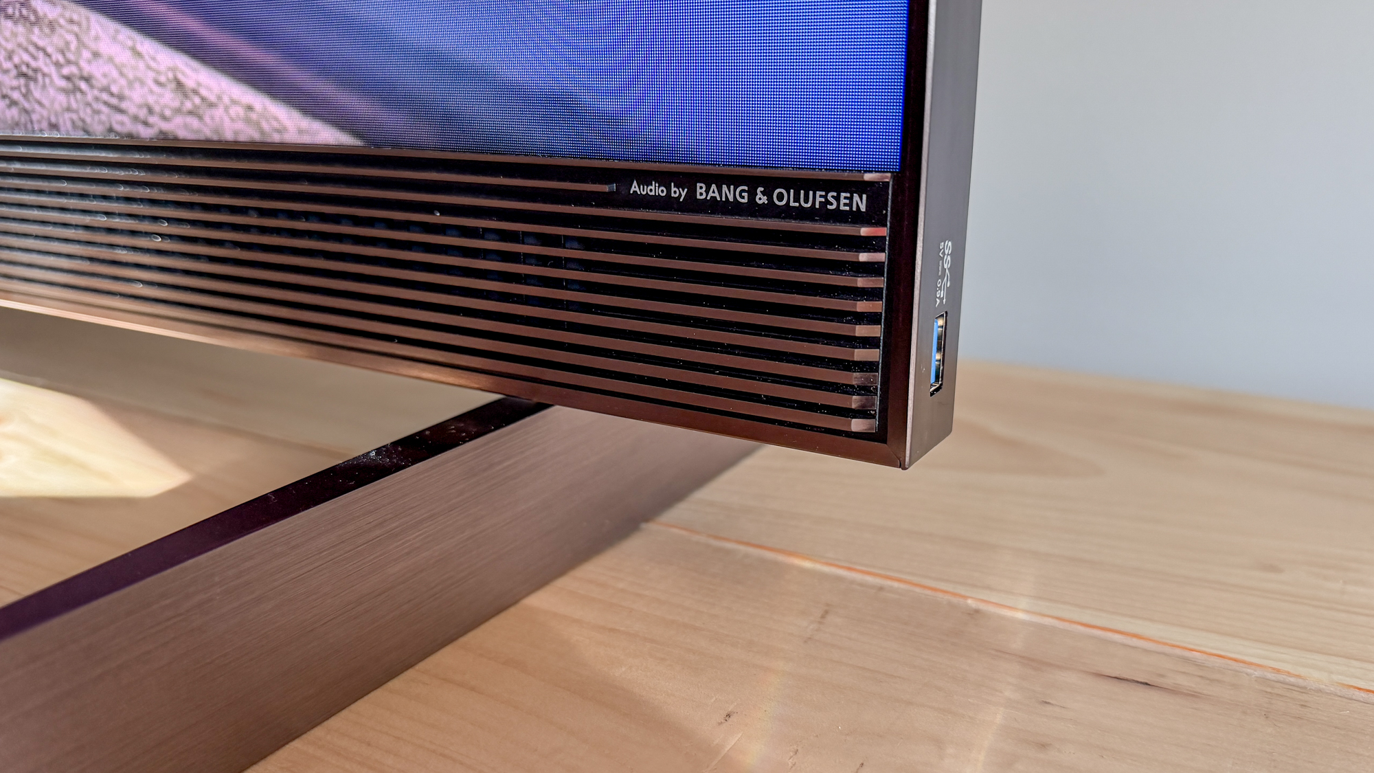 TCL X11L SQD Mini-LED TV on a side table