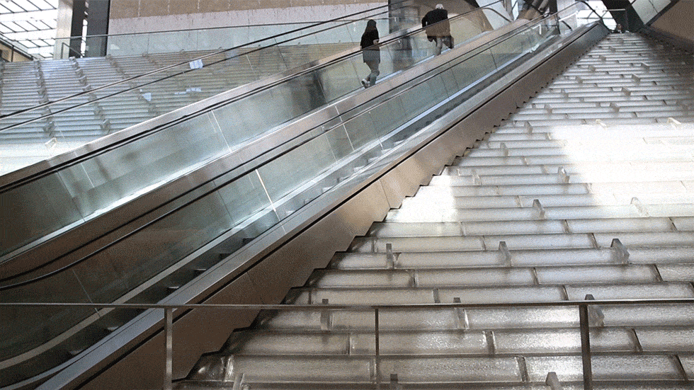 GIF - Wearing Gown Whilst Going Up Escalator