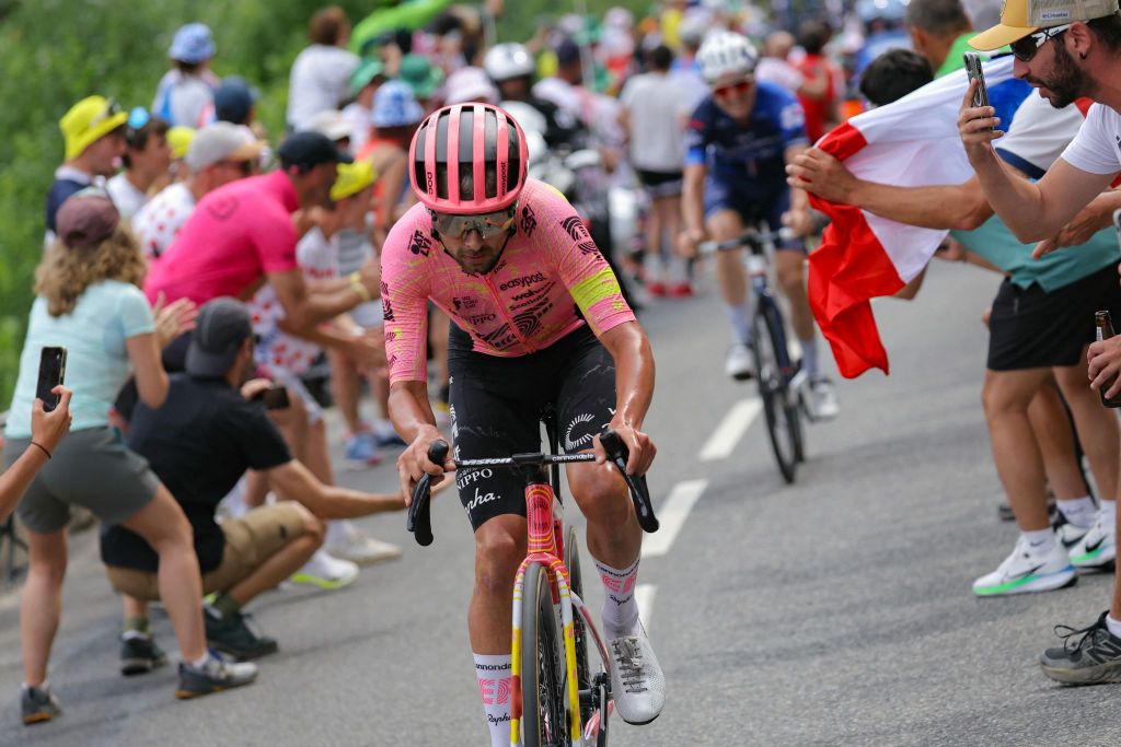 EF Education - EasyPost team's Irish rider Ben Healy cycles in a lone breakaway in the final ascent of Saint-Lary-Soulan Pla d'Adet during the 14th stage of the 111th edition of the Tour de France cycling race, 151,9 km between Pau and Saint-Lary-Soulan Pla d'Adet, in the Pyrenees mountains in southwestern France, on July 13, 2024. (Photo by Thomas SAMSON / AFP)