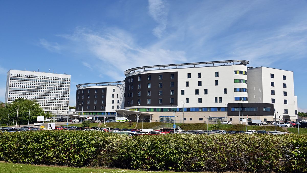 An exterior photo of NHS Fife Victoria hospital in Kirkcaldy showing multiple large blue and white buildings