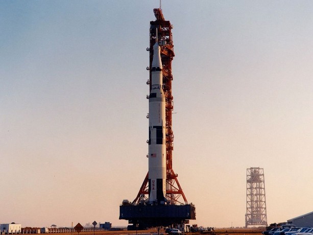 A tall black and white rocket and spacecraft