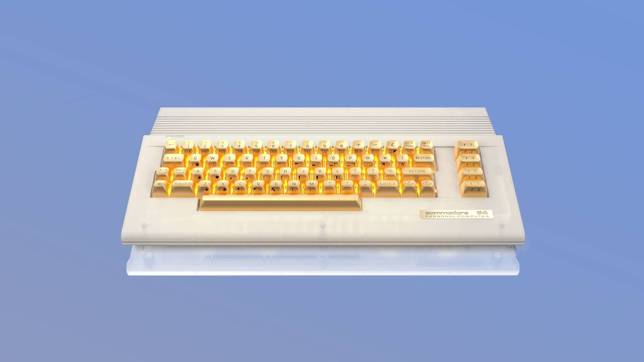 C64C Ultimate Founders Edition with gold keys with blue backdrop.