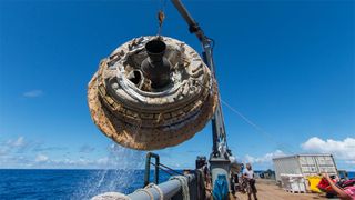 NASA's Low-Density Supersonic Decelerator, which is being used to test techniques for atmospheric entry on Mars, is lifted aboard a recovery vessel after its test launch. Image credit: NASA