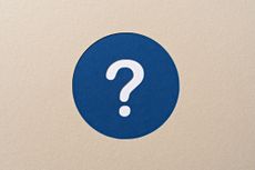 white question mark on a blue circle against a beige background