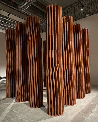 Jordanian architect Sahel Alhiyari’s eleven towering terracotta columns