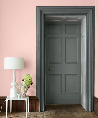 hallway paint ideas with pink wall and grey door
