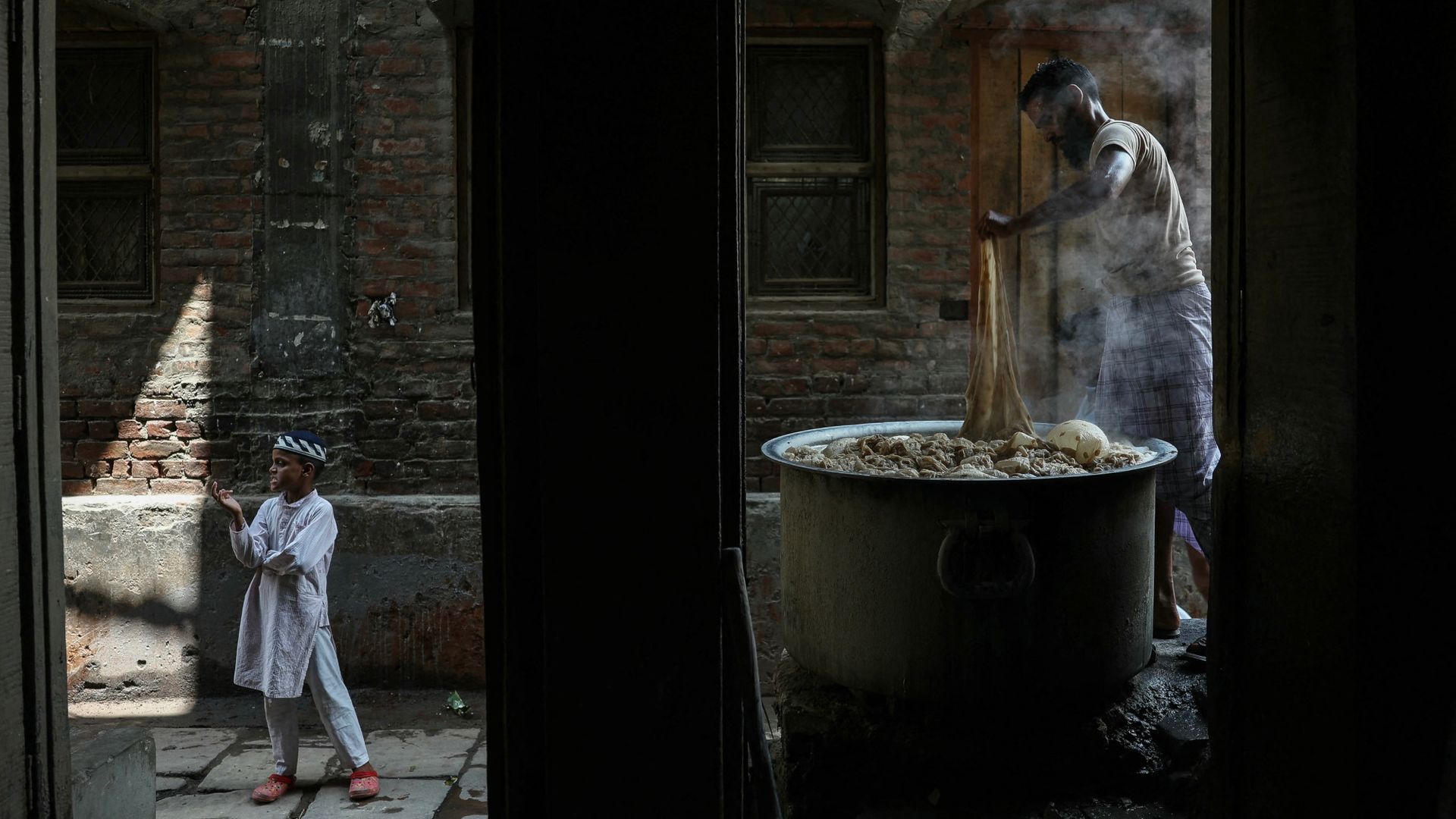 
                                A Banarasi saree is dyed by hand in a workshop in Varanasi, India
                            