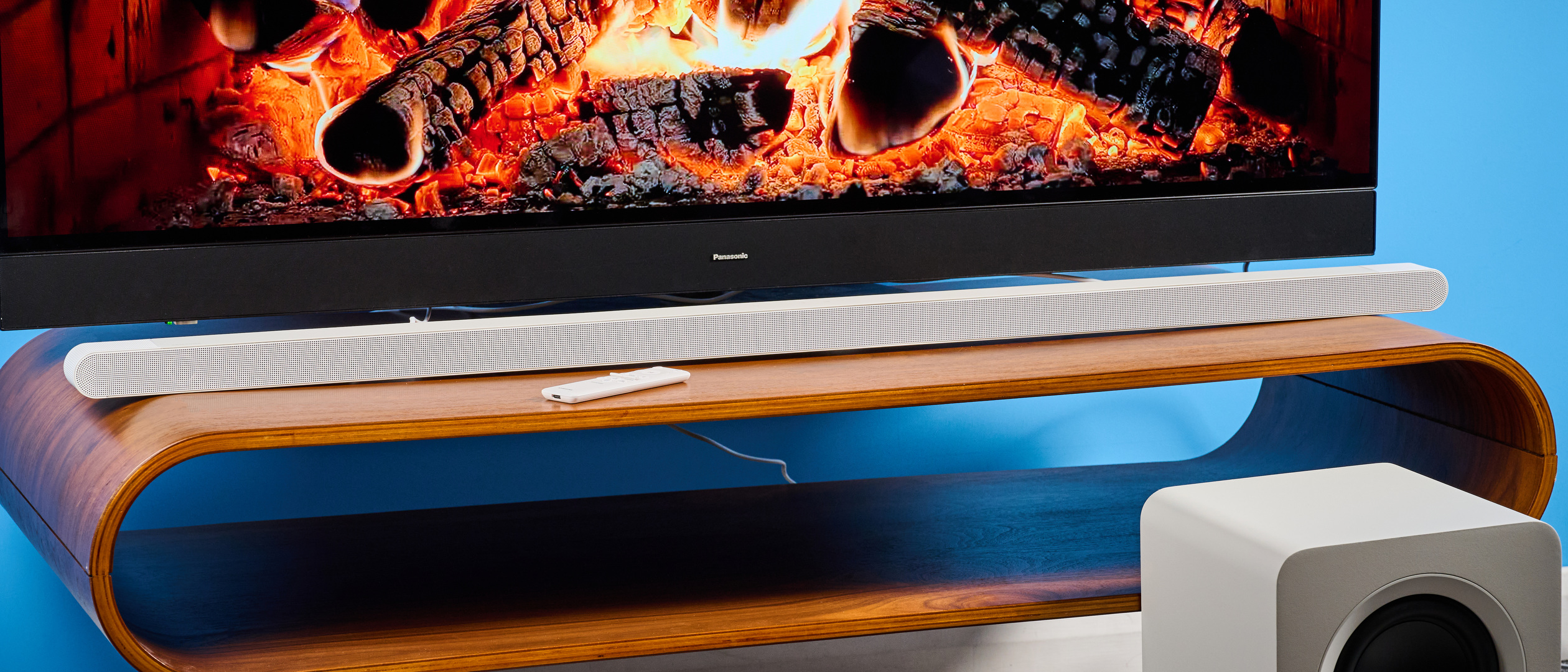 the samsung hw-s801d soundbar and subwoofer in white, an ultra slim soundbar with on-bar buttons, a remote, and separate subwoofer with a black cone
