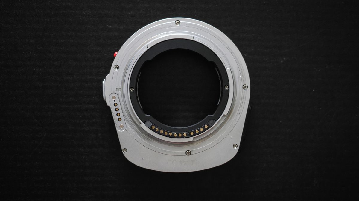 Megadap M2RF adapter on a black surface