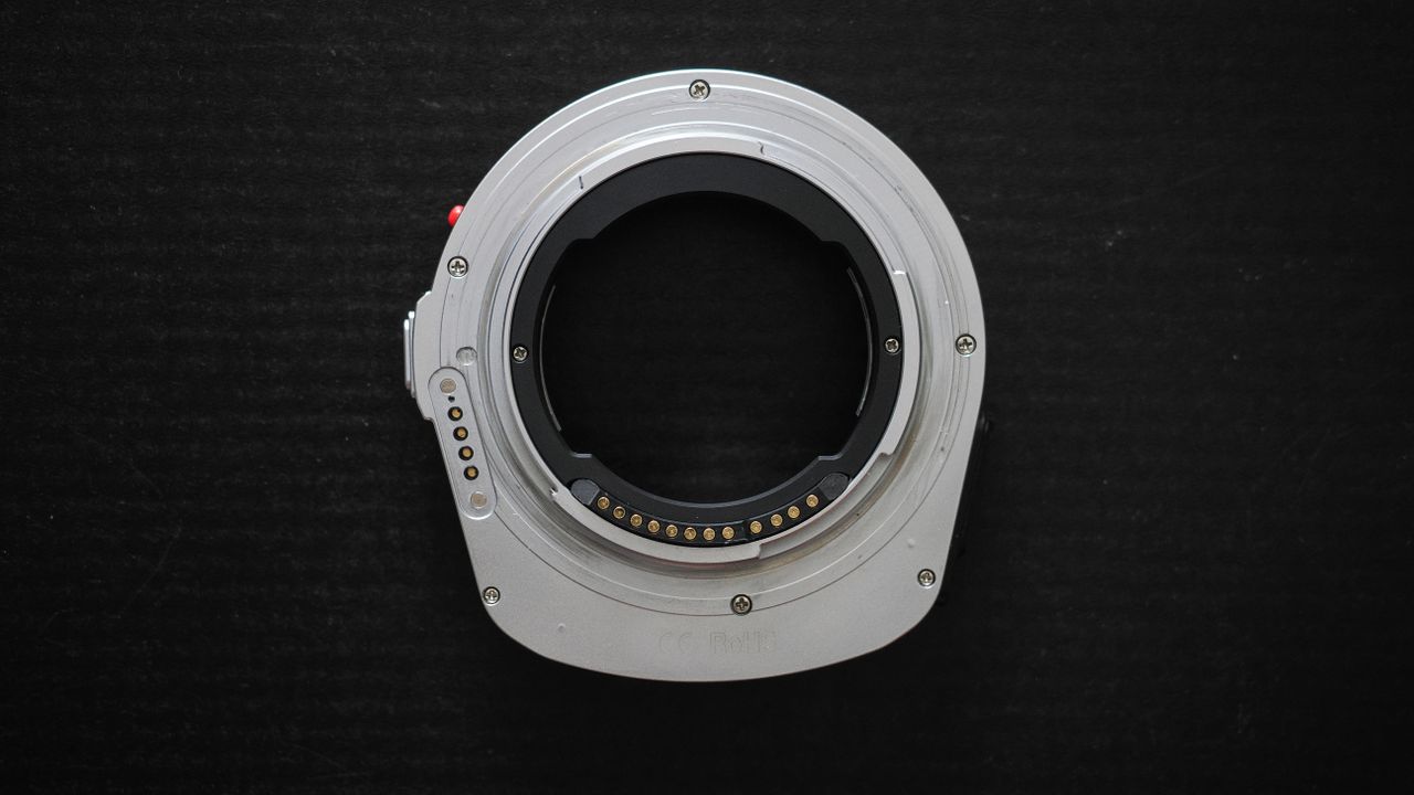 Megadap M2RF adapter on a black surface