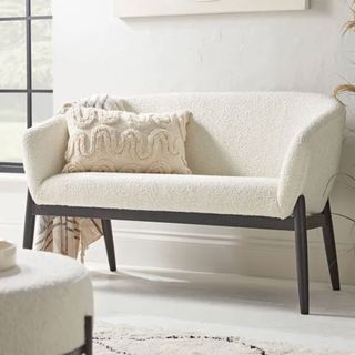 Cox & Cox curved ivory boucle sofa in white living room