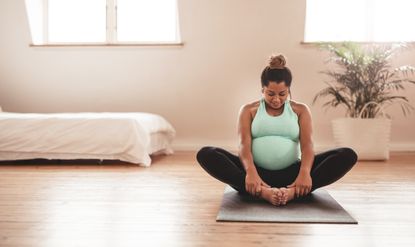 Safe pregnancy workout: A woman working out while pregnant