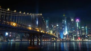 A view of a shining cityscape across a bridge and river on Krill in The Orville.
