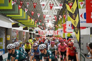 JEREZ DE LA FRONTERA SPAIN AUGUST 22 A general view of the peloton competing at the start of race inside a shopping mall prior to the La Vuelta 79th Tour of Spain 2024 Stage 6 a 1855km stage from Jerez de la Frontera to Yunquera UCIWT on August 22 2024 in Jerez de la Frontera Spain Photo by Dario BelingheriGetty Images