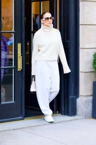 Jennifer Lopez in New York City April 2024 wearing a head to toe cream outfit
