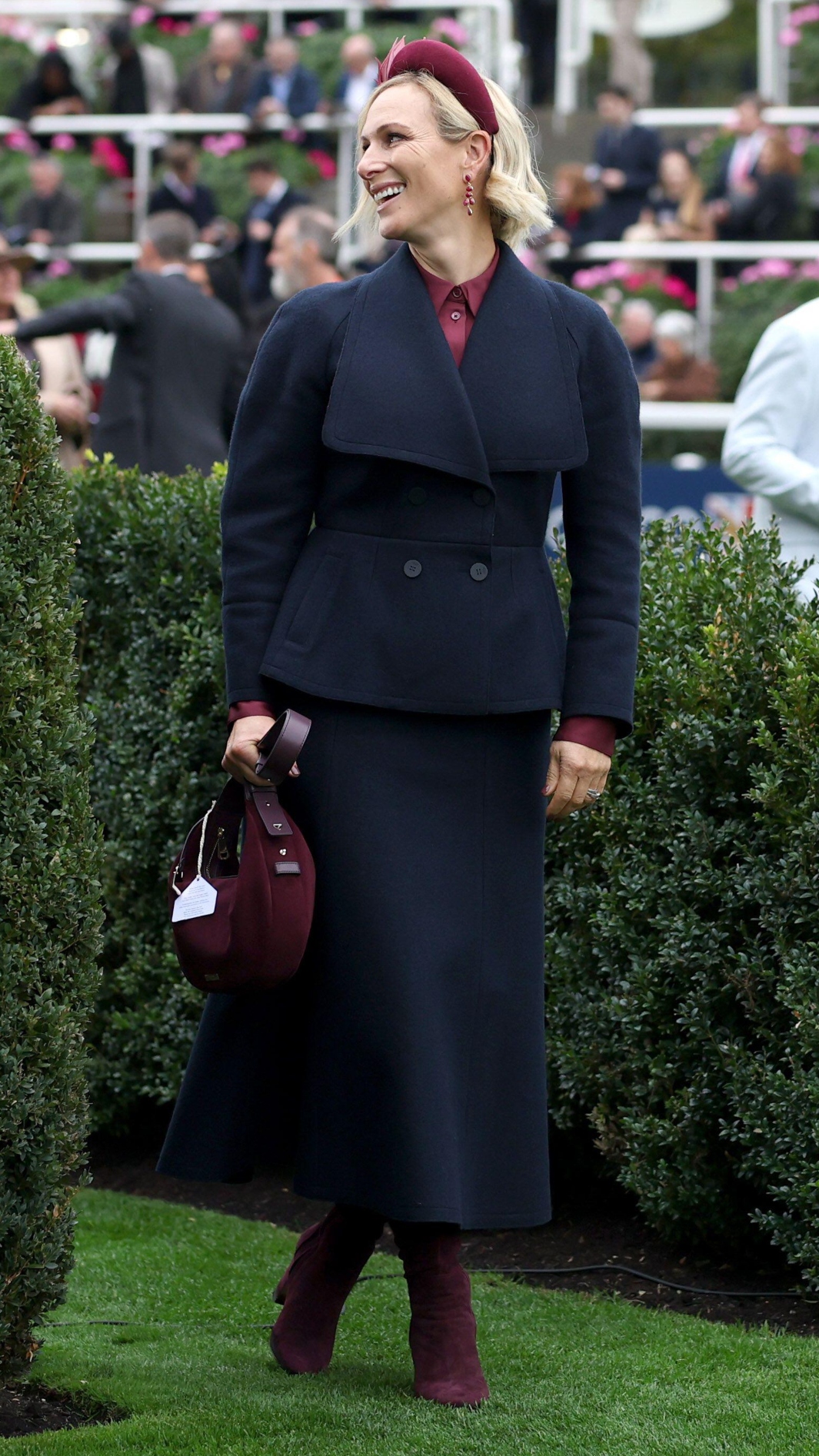 Zara Tindall smiles and walks in the parade ring during the QIPCO British Champions Day at Ascot Racecourse