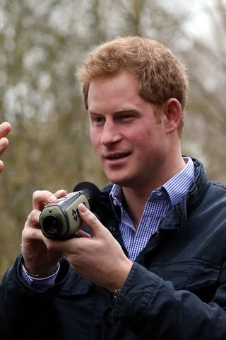 Prince Harry using a camera