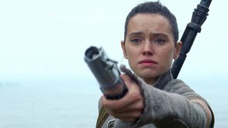Rey holds out lightsaber Star Wars The Force Awakens Lucasfilm