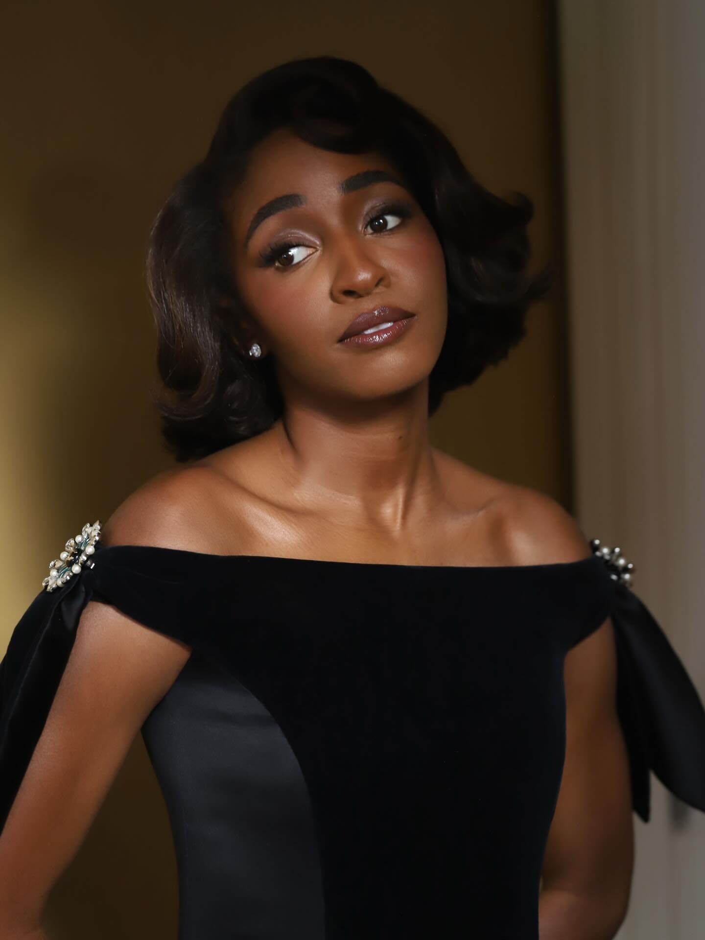 Ayo Edebiri with a bouncy brunette bob