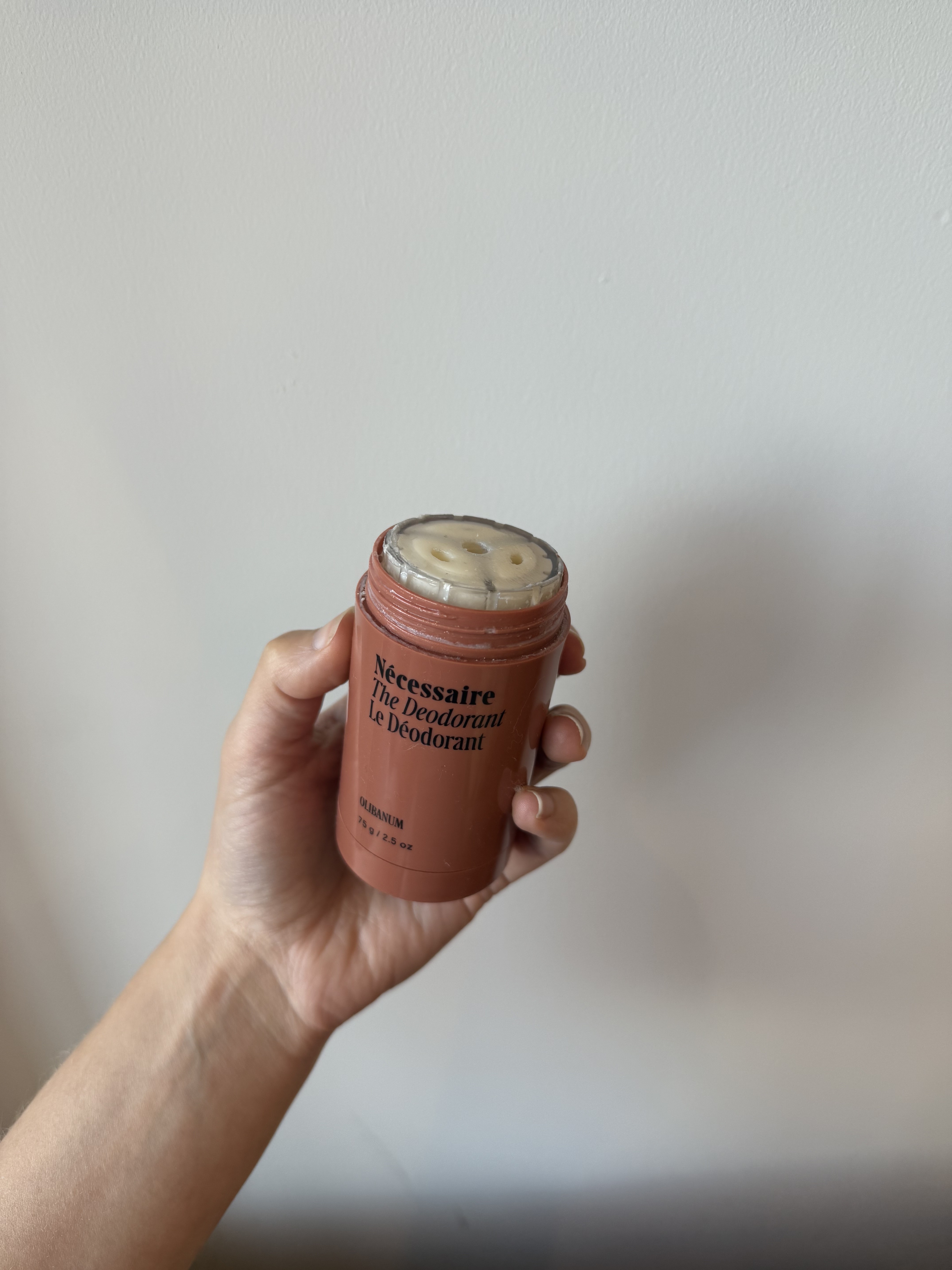 Photo of Jamie Schneider using Nécessaire's deodorant