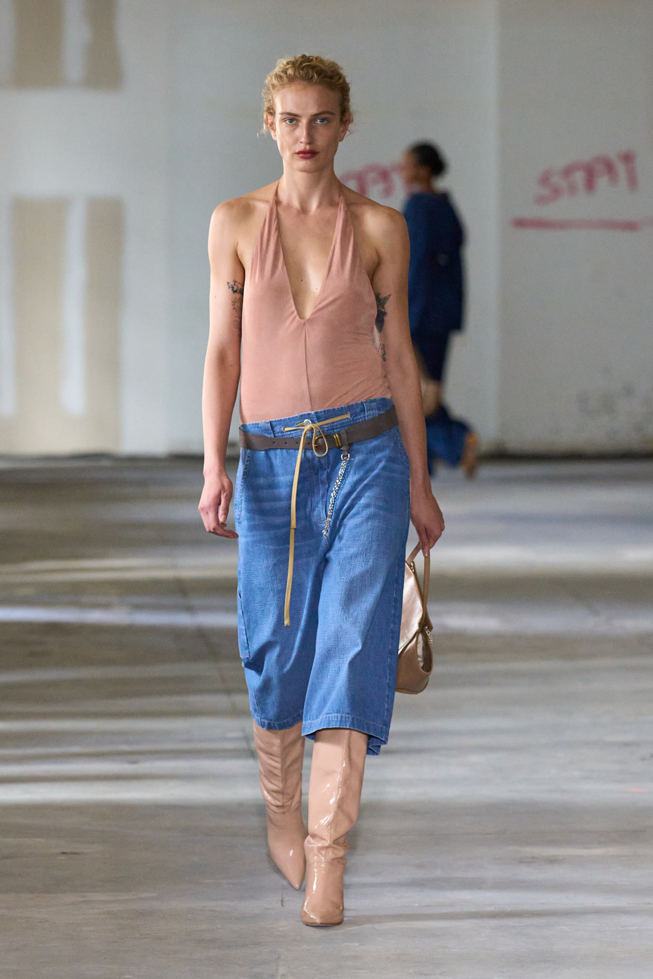 Woman in jorts and halterneck top