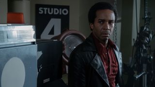 André Holland as Huey P. Newton in a black coat in The Big Cigar