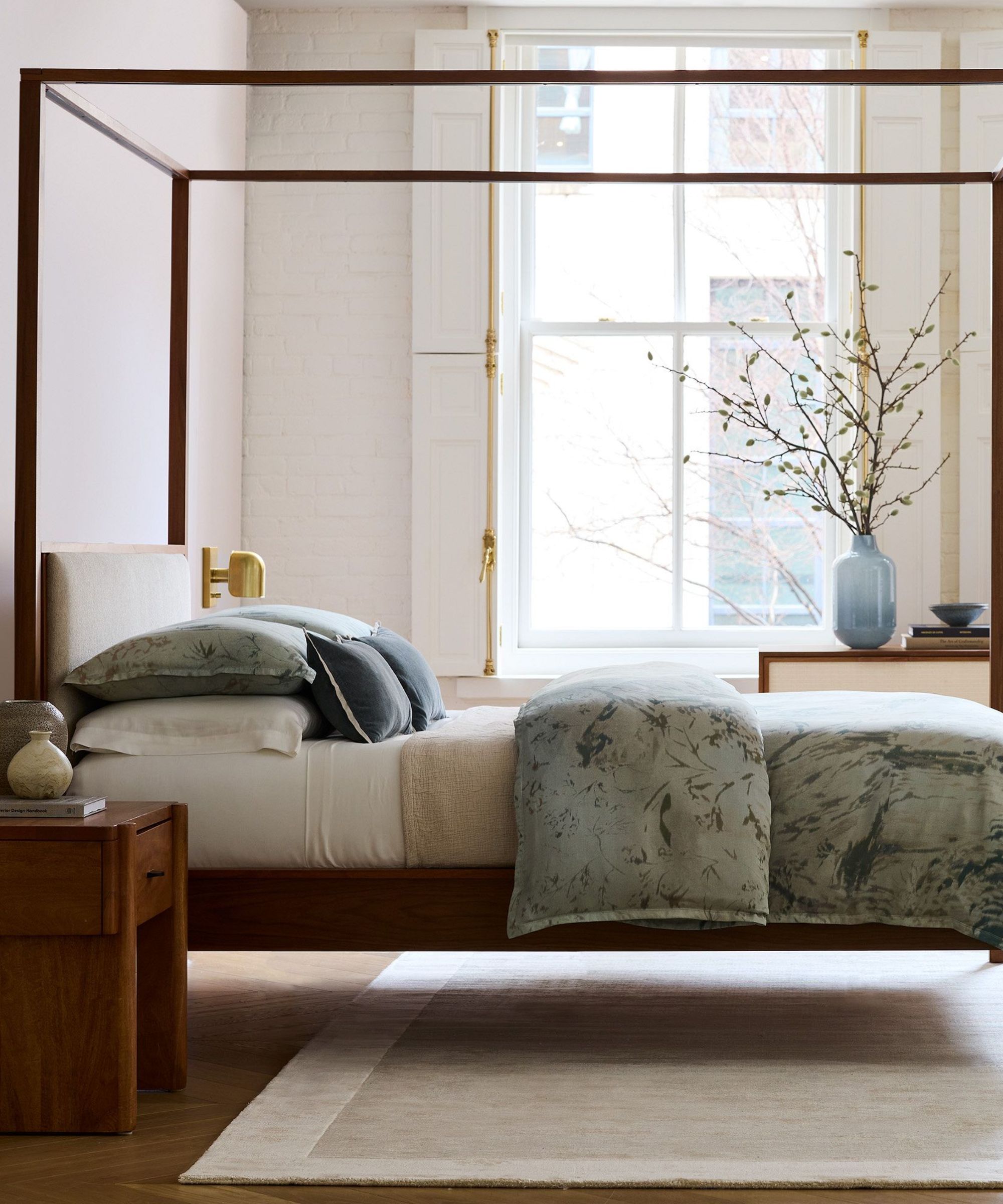 west elm neutral bedroom with four poster bed