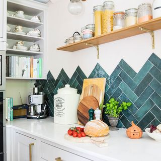 kitchen with green tiles and shelf