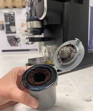 Close-up of HomeBarista® Reusable Filter Cup filled with spent coffee grounds