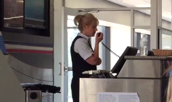 An employee announces computer issues at American Airlines.