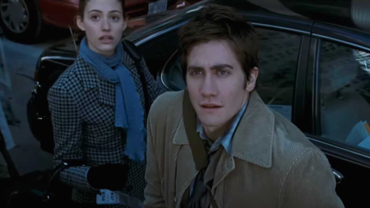 Emmy Rossum and Jake Gyllenhaal look up in bewilderment in The Day After Tomorrow.