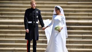 Prince Harry, Duke of Sussex and Meghan, Duchess of Sussex leave from the West Door of St George's Chapel on their wedding day