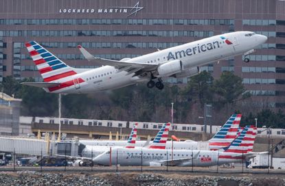 An American Airlines plane takes off.