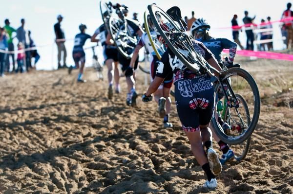 Riders make the sandy run on the way to the barriers.