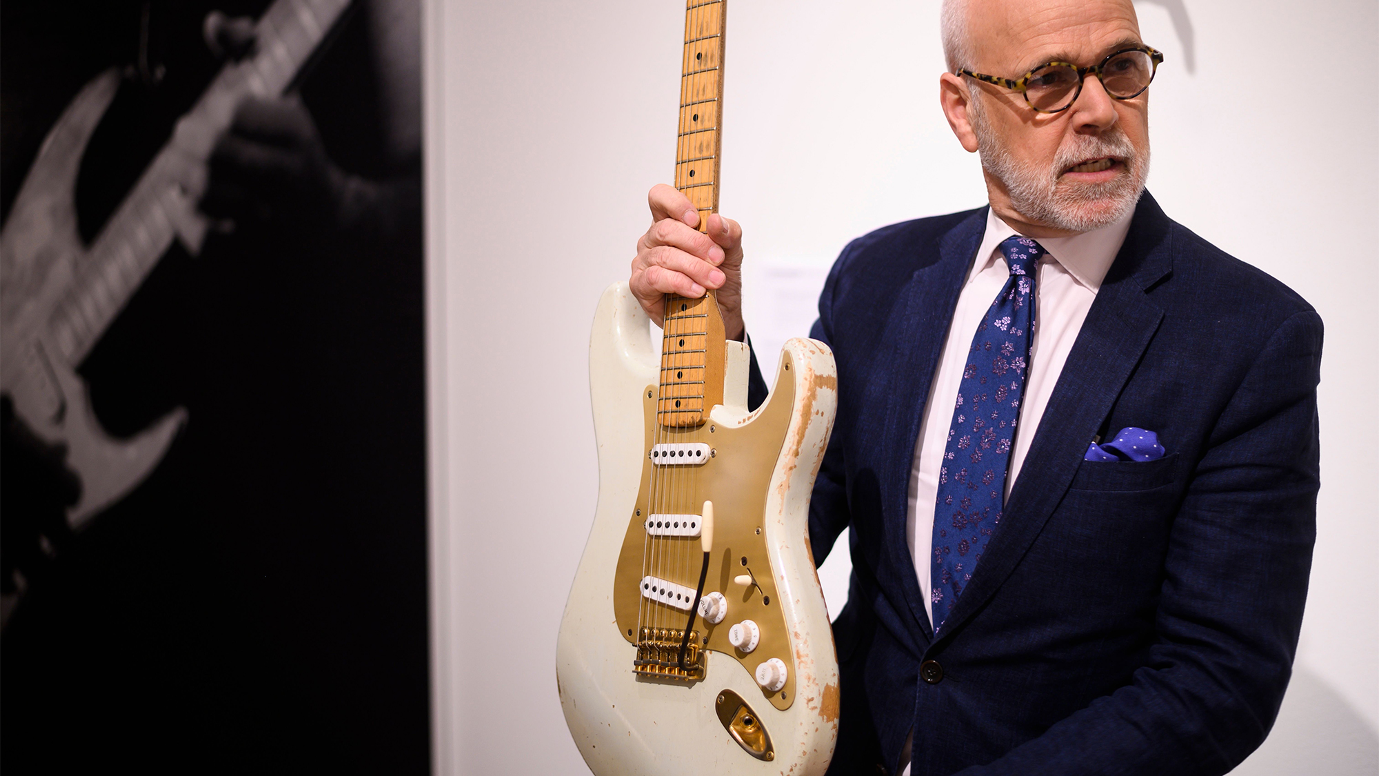 Kerry Keane, Christie's Musical Instruments Specialist, holds the Fender Stratocaster, (ca 1954 with the serial number 0001) from David Gilmour at Christie's on June 14, 2019 in New York City.