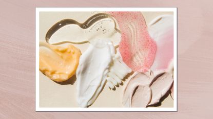 Samples of creams, face mask, scrub with exfoliating particles, face gel and serum spread over a cream backdrop/ in a pink textured template