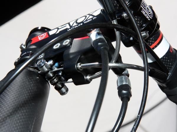Conventional cables are fed into the front of TRP's Parabox mechanical-to-hydraulic converter, which are then connected to the piston actuator arms.