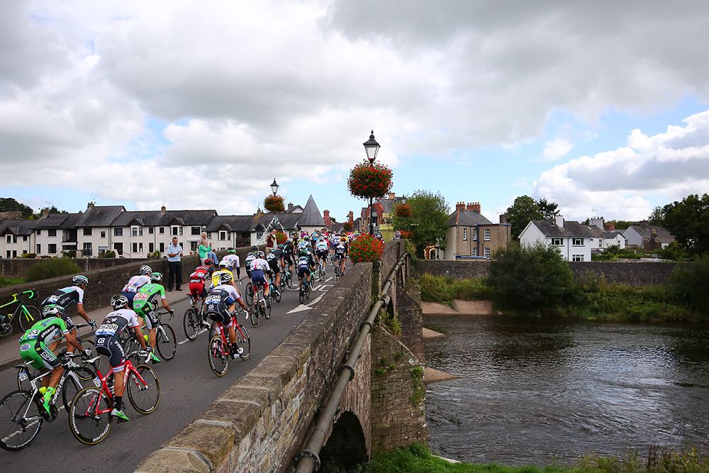 The peloton crosses a bridge during stage 5 at the Tour of Britain.