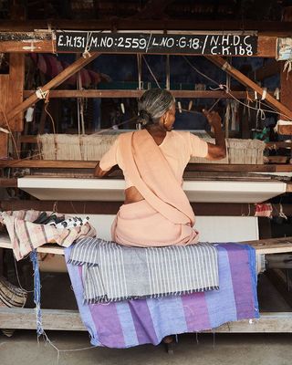 Aristans with the Oshadi Collective weaving and block printing the farmed cotton.