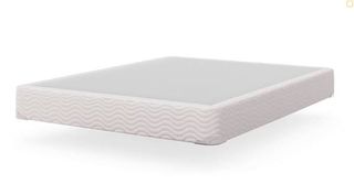 Saatva Mattress Foundation against a white background without a mattress on top