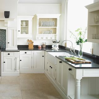 kitchen with white wall and wash basin
