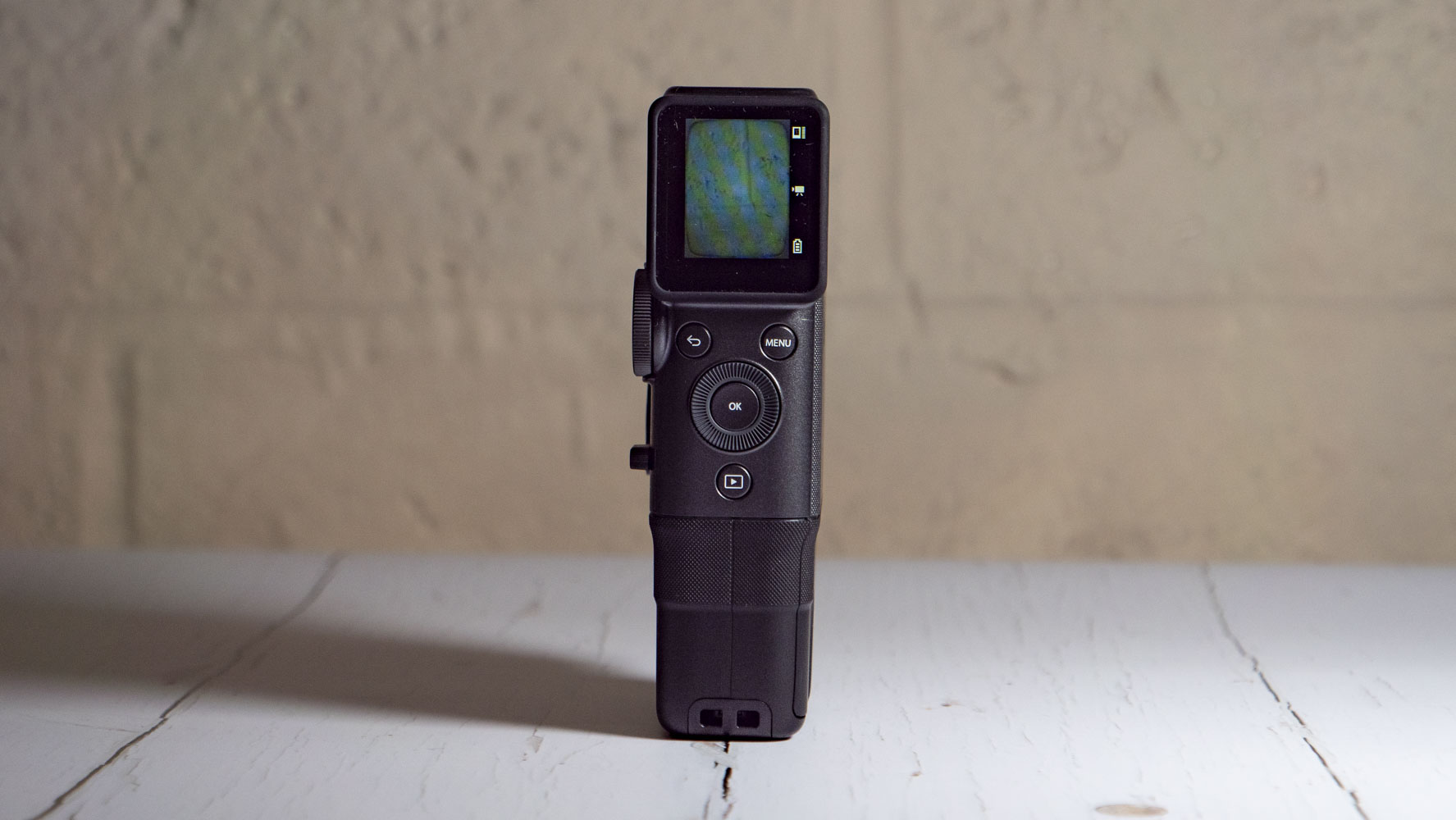 Fujifilm Instax Mini Evo Cinema on a white wooden surface