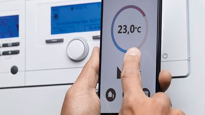 Adjusting boiler temperature through mobile phone